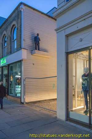 Colchester /  Man with Cup and Walking Woman