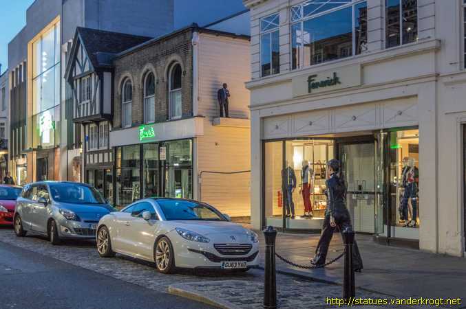 Colchester /  Man with Cup and Walking Woman
